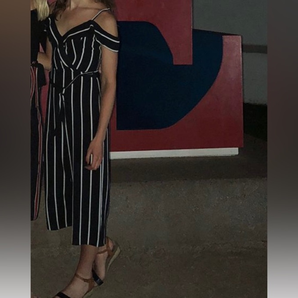 A Byer striped jumpsuit; fits like a 4